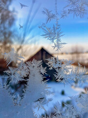 Frosty pattern on the window - 478161895