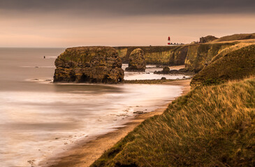 The view along Marsden Bay near Sunderland, of the cliffs and the Sandstone Sea stacks, as the tide comes in
