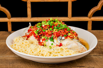 Steamed fish head with diced hot red peppers