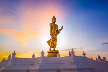 Buddha image or Buddha statue; Standing Buddha image with sunlight ray at Nong Pai Lom temple. 