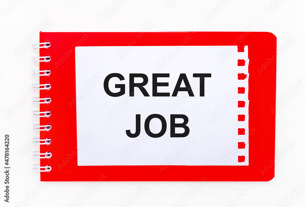 Poster on a white background - a bright red notebook on a spiral. on it is a white sheet of paper with the 