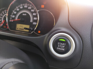 Close-up of the engine, the car's speedometer and the amount of fuel. Cheap oil concept. Hurry to fill up the tank.