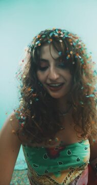 Girl enjoying confetti.