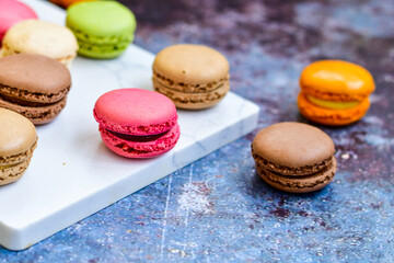 Selection of colorful french macaroons on   industrial background . Patisserie Banner