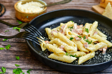  Fresh home made italian  penne  pasta   alla carbonara with  cream sauce  ,  bacon,egg, parmesan cheese ,olive oil and black pepper) 