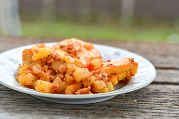  Potato and minced meat  Casserole  with   parmesan cheese and garlic on wooden rustic bakcground.  Bulgarian moussaka