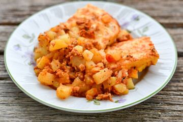  Potato and minced meat  Casserole  with   parmesan cheese and garlic on wooden rustic bakcground.  Bulgarian moussaka
