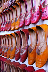 Colorful Handmade chappals (sandals) being sold in an Indian market, Handmade leather slippers, Traditional footwear.