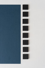 black tiles with blue paper