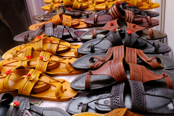 Colorful Handmade chappals (sandals) being sold in an Indian market, Handmade leather slippers,...