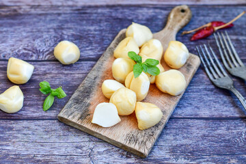  Smoked mini  traditional italian provola  cheese  on wooden background