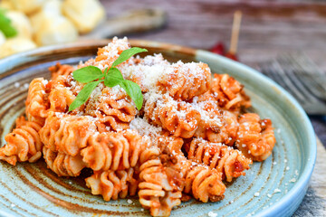  Home made italian   radiatori bolognese fresh   pasta  on rustic background. Mediterranean food concept