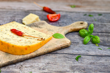  Set of different kinds ot delicious   Italian hard  cheeses,  cheese knives  and walnuts on wooden cheese board.Parmesan. Top view.