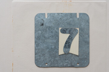 galvanized steel plate with the number 7 on paper