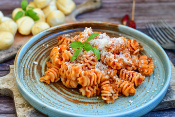  Home made italian   radiatori bolognese fresh   pasta  on rustic background. Mediterranean food concept