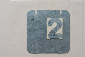 galvanized steel plate with the number 2 on paper