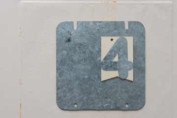 galvanized steel plate with the number 4 on paper