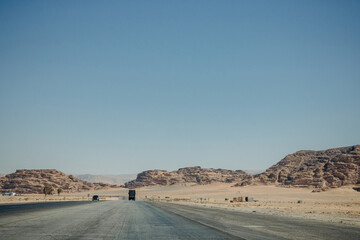 Deserted light mountains and blue sky. Landscape by the road. Jordan