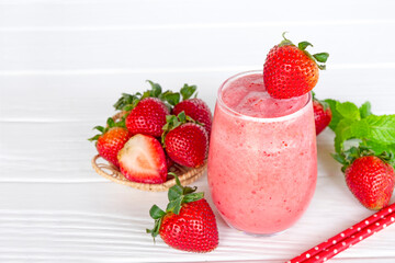 Strawberry yogurt fruit juice smoothie pink colorful fruit juice milkshake blend beverage healthy high protein the taste yummy In glass drink episode morning on white wood background.