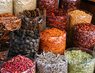 Colorful baskets of condiments in a Dubai market