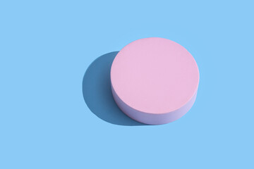 Pink podium on bright blue background. Concept scene stage showcase, for product, promotion, sale, banner, presentation product cosmetic. Minimal showcase mock up concept Pattern
