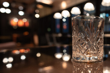 Empty Glass Whisky with blurred background in Hotel Bar