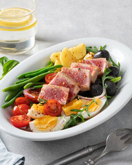 traditional French dish, nicoise salad with fried tuna steak