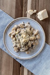 Gnocchi with vegan creamy sauce, porcini mushrooms and vegan cheese