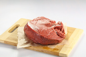 Raw beef meat over board