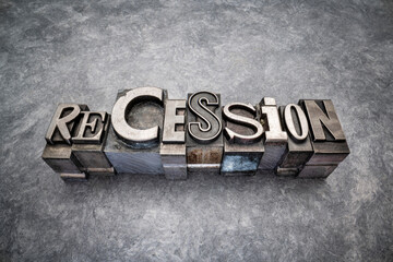 recession word abstract in gritty vintage letterpress metal types, mixed fonts against handmade bark paper, market crash, business cycle or economics concept