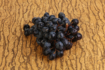 Purple grape branch over background