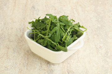 Fresh green arugula in the bowl