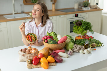 Woman in the kitchen with vegetables. High quality photo