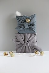 Easter eco-friendly gift wrapping in traditional Japanese Furoshiki style. Zero waste, environmental gift wrapping concept,