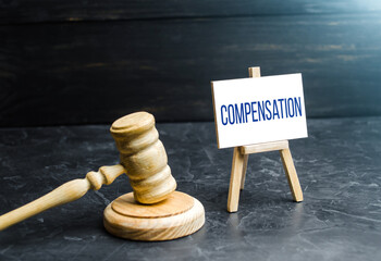 Compensation and judge's gavel. Award of moral financial compensation for caused damage. Lawyer...