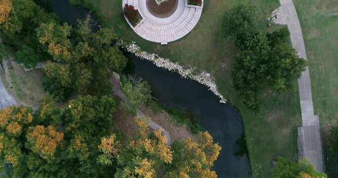 Drone flying over fountain in Granbury Texas. During the fall season.