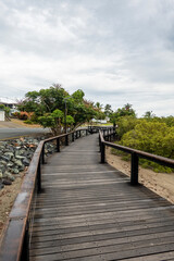 Fototapeta na wymiar Timber Boardwalk By The Sea