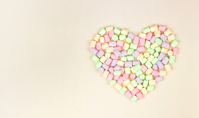 Colorful marshmallow heart for Valentine Day as background, concept of sweet dessert