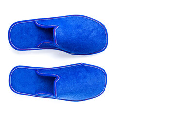 Blue home slippers on white background. Copy space