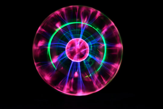 Plasma ball with iridescent different colors on a black background