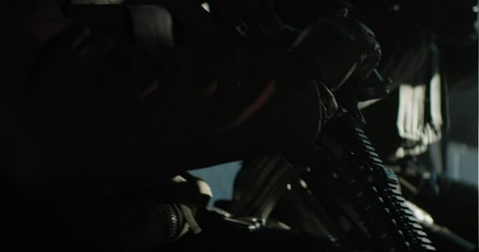 Swat team goes in the middle of the bus to leave. Military special forces hold machine guns in their hands. Cinematic video shot on Arri Alexa with anamorphic lenses.