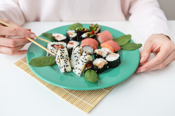 Meals, various types of maki sushi, philadelphia, maki, salmon, rice, salad. Delicious and healthy food.