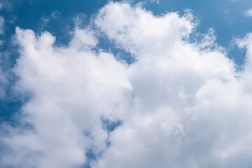 Blurry fluffy epic blue sky with white clouds
