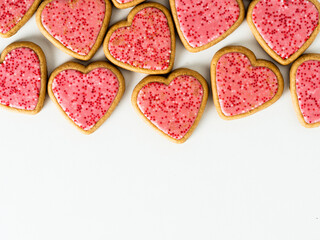 Top view of some strawberry cookies on a white background with copy space. 