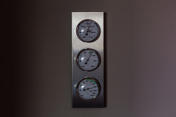 Round barometer, thermometer, hygrometer. Analog device for measuring measurement of atmospheric...