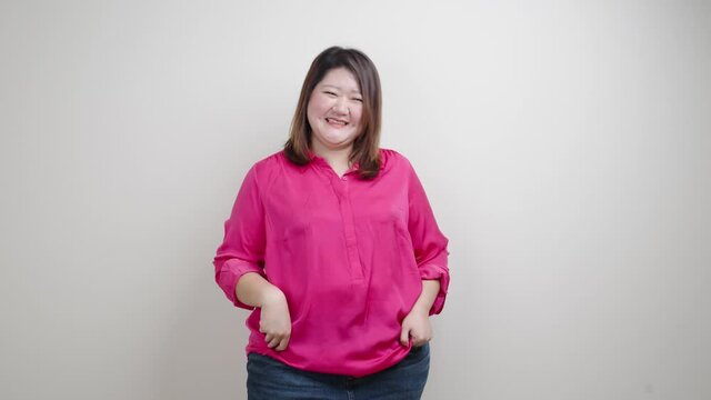 Fat woman pink shirt, Obese woman happy and smile belly fat isolated on clean background, Overweight fatty belly of woman diet lifestyle overweight Happy and self-esteem concept.