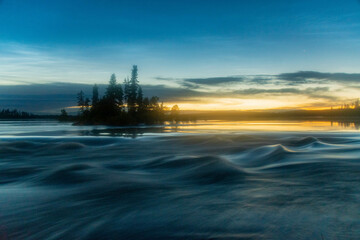 Sunset over the northern Canadian river Rapids