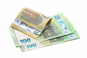 Two hundred euro banknotes, cash paper money and paper clips isolated on white  