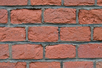 Obraz premium The texture of the wall from old red bricks, closeup.