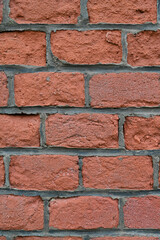 Obraz premium The texture of the wall from old red bricks, closeup.